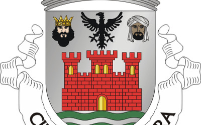 Coat of arms of Cidade de Albufeira showing red castle with crown and historical emblems